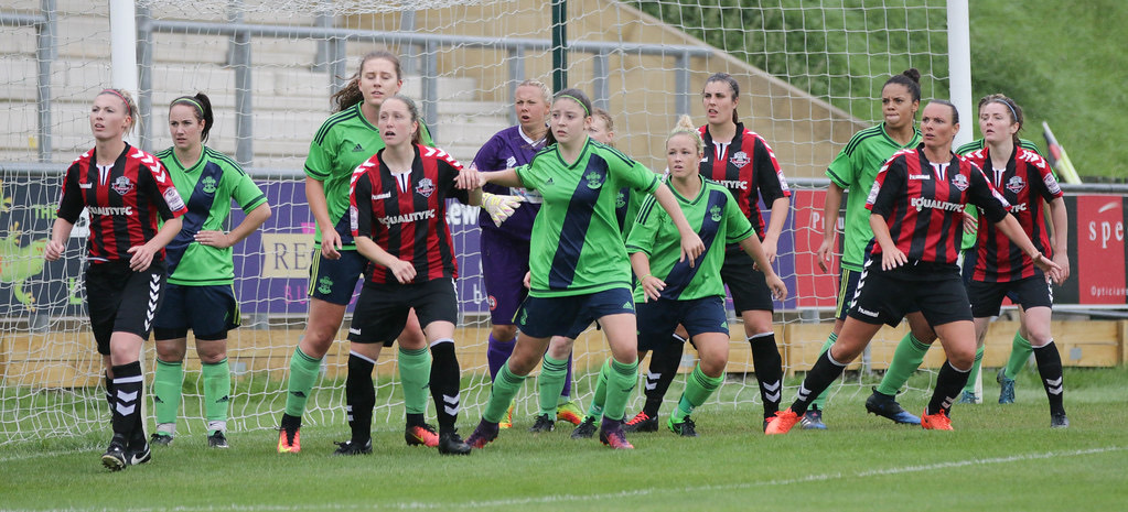 Players jostle for position in the goalmouth at a corner